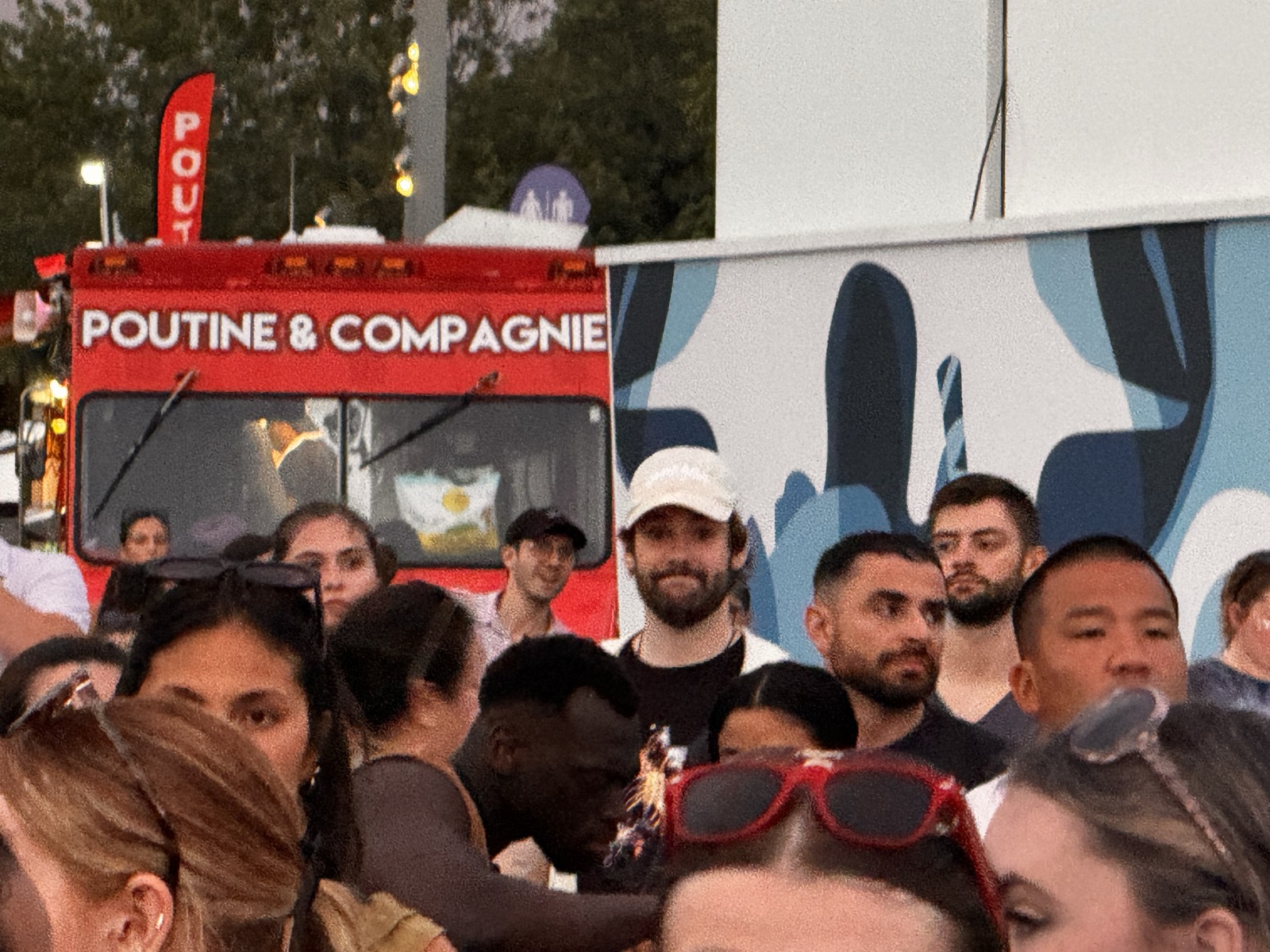 The crew at a poutine truck, Osheaga Montreal 2024